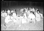 Group of Students Laying in Field and Talking by Fred A. Blocker