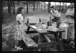 Students Standing by Picnic Table by Fred A. Blocker