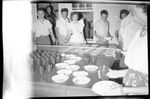 Students Grabbing Premade Plates of Food by Fred A. Blocker
