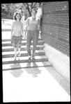 Two Students Smiling on Steps by Fred A. Blocker