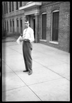 Student Standing in front of Old Main Dormitory by Fred A. Blocker