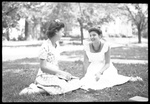 Students Sitting in Grass Talking by Fred A. Blocker
