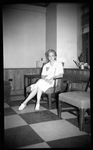 Woman Sitting in Chair by Fred A. Blocker