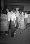 Students Standing Around Talking by Fred A. Blocker
