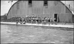 Students Talking Around Swimming Pool by Fred A. Blocker