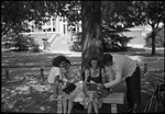 Students Sitting on Bench by Fred A. Blocker