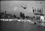 Student Jumping Sideways from Diving Board by Fred A. Blocker