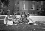 Group of Students Sitting in Grass by Fred A. Blocker