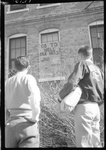 Students Looking Up at "Go To Hell Ole Miss" Graffiti by Fred A. Blocker