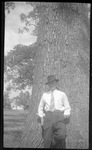 Student Leaning Against Tree by Fred A. Blocker