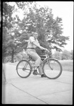 Student Posing on Bike by Fred A. Blocker