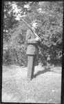 Student in Uniform Holding Rifle by Fred A. Blocker