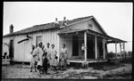 Family in front of House by Fred A. Blocker