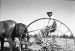 Man on Farm Equipment by Fred A. Blocker