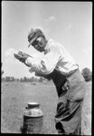 Man Posing with Jug by Fred A. Blocker