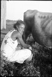 Girl Milking Cow by Fred A. Blocker