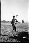 Man Posing with Axe by Fred A. Blocker