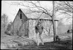 Man Standing in front of Barn by Fred A. Blocker