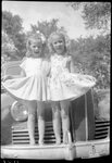 Girls Standing on Car's Bumper by Fred A. Blocker