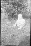 Baby Sitting in Grass by Fred A. Blocker