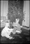 Children in front of Christmas Tree by Fred A. Blocker