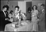 People Making Plates of Food at Party by Fred A. Blocker