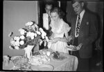 People Making Plates of Food at Party by Fred A. Blocker