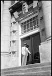 Man in front of Lee Hall by Fred A. Blocker