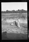 Man and Dog on Sandbank by Fred A. Blocker