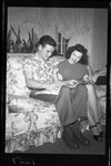 Couple Sitting on Couch by Fred A. Blocker