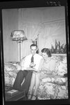 Couple Sitting on Couch by Fred A. Blocker