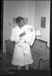 Woman Holding Baby by Fred A. Blocker