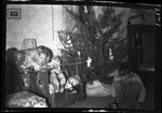 Boy and Girl in front of Christmas Tree by Fred A. Blocker