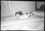 Baby on Bed by Fred A. Blocker