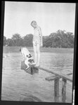 Boy and Dog on Makeshift Diving Board by Fred A. Blocker