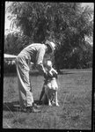 Man and Child with Dog by Fred A. Blocker