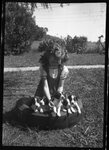 Girl with Puppies by Fred A. Blocker