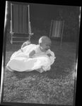 Baby Laying Outdoors by Fred A. Blocker