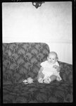 Baby Sitting on Couch by Fred A. Blocker