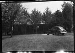 Car Parked in front of House by Fred A. Blocker