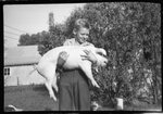 Boy Holding Pig by Fred A. Blocker