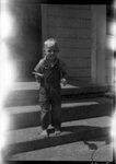 Boy Standing on Small Staircase by Fred A. Blocker