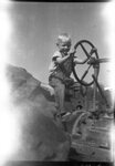 Boy on Tractor by Fred A. Blocker