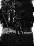 Children Playing on Swing Set by Fred A. Blocker