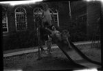 Children Playing on Slide by Fred A. Blocker