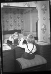 Child Combing Hair in Mirror by Fred A. Blocker