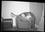 Boy Reading Comic Book in Chair by Fred A. Blocker
