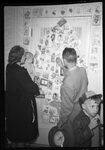 People Looking at Christmas Display by Fred A. Blocker