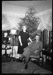 Couple in front of Christmas Tree by Fred A. Blocker