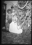 Boy Next to Christmas Tree by Fred A. Blocker